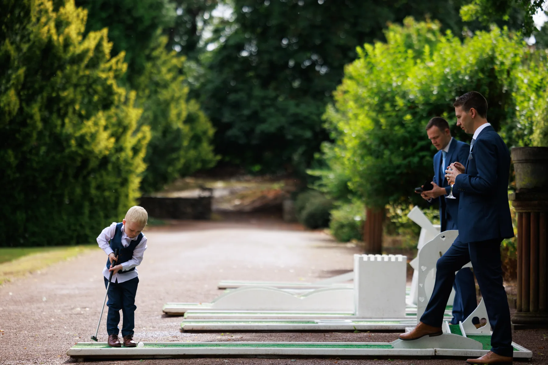 Wedding guests playing garden games at Clearwell Castle