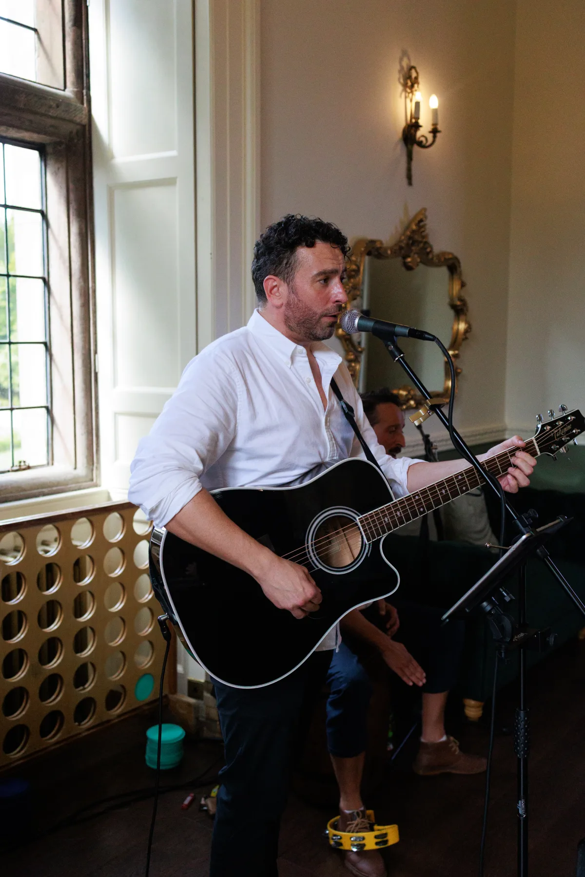 Live guitarist performing during a wedding reception