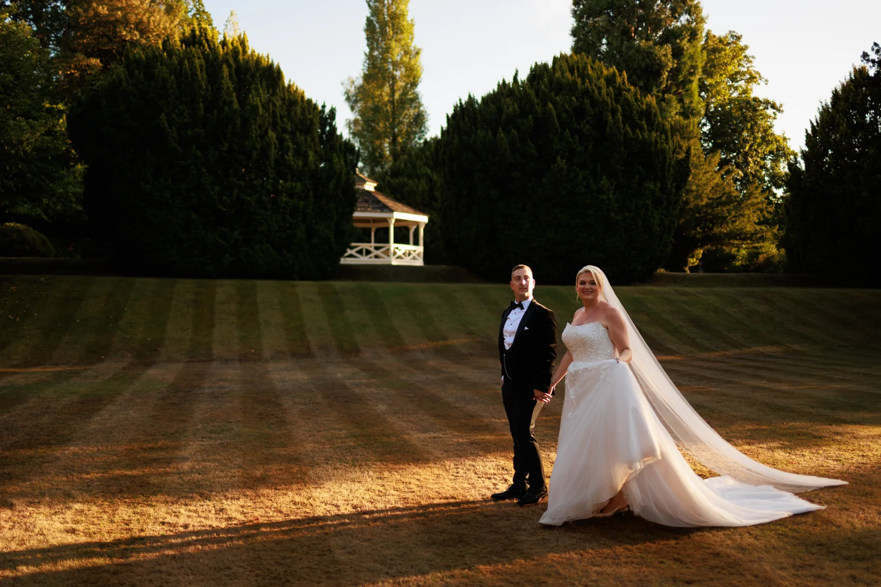 Emily and David standing together near the Clearwell Castle bandstand