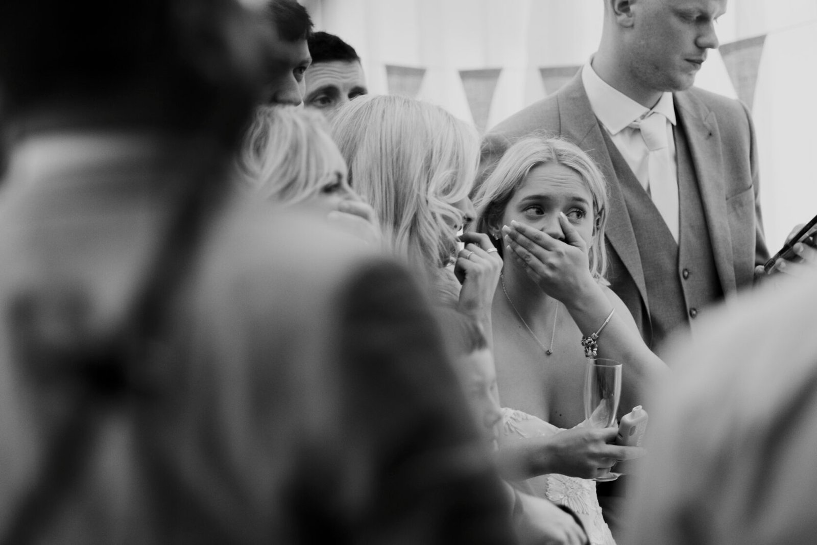 Emotional wedding guest reacting during the reception