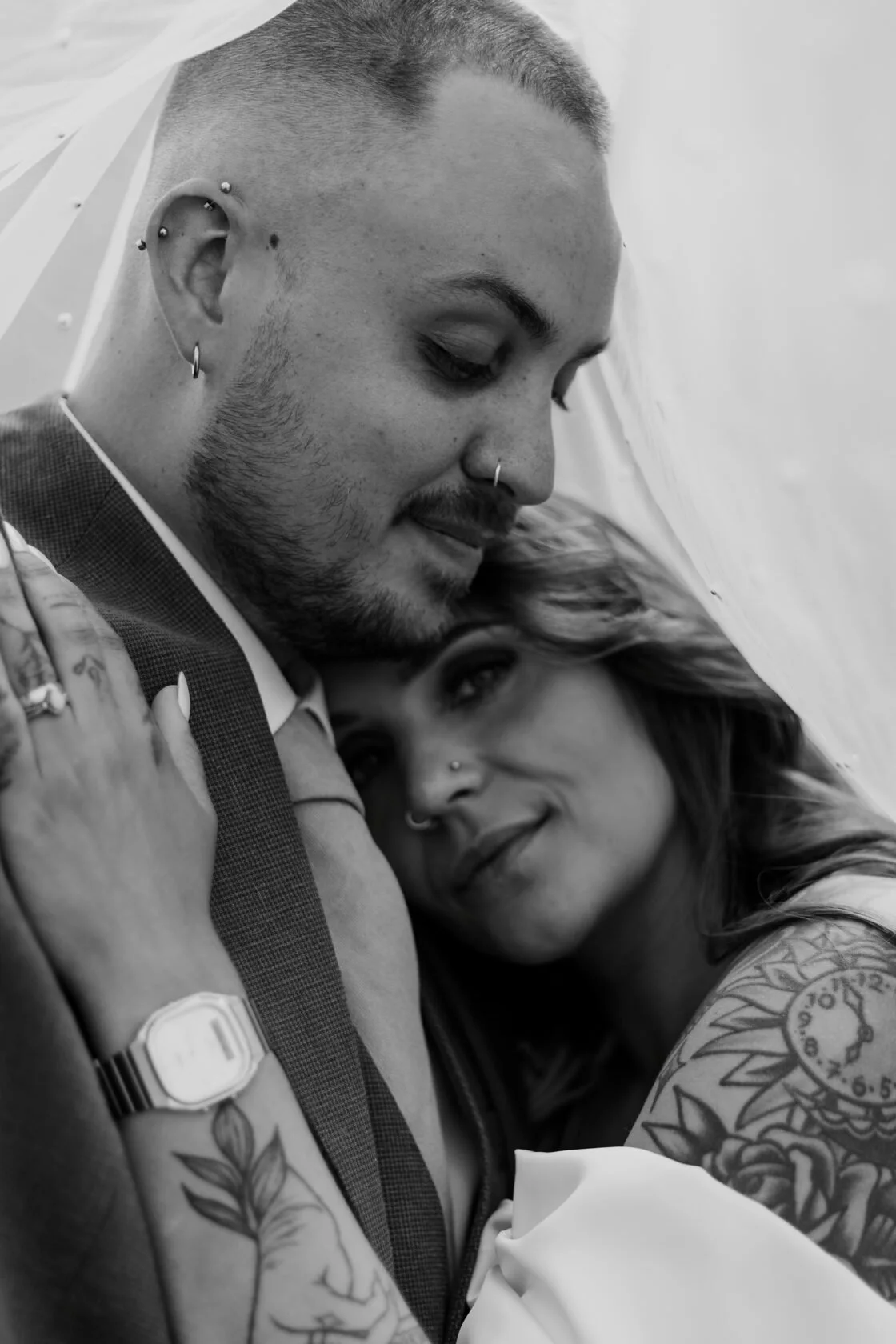 Newlyweds embracing in a relaxed black-and-white portrait