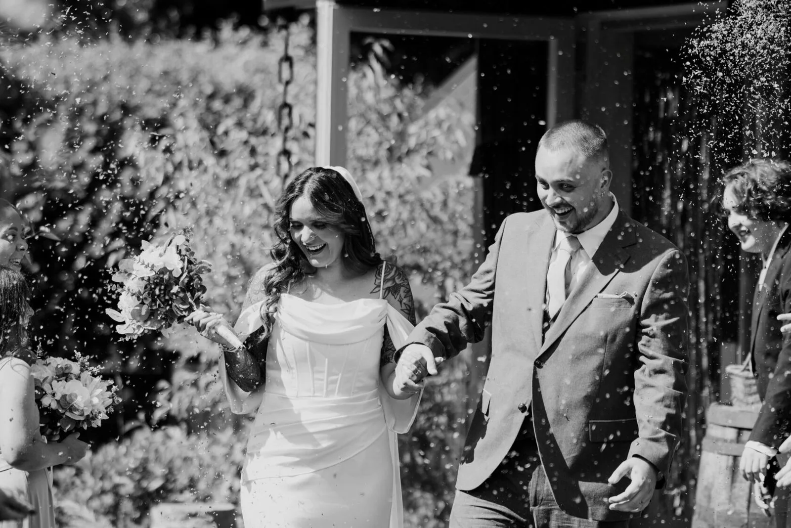Newlyweds smiling as they leave their wedding ceremony
