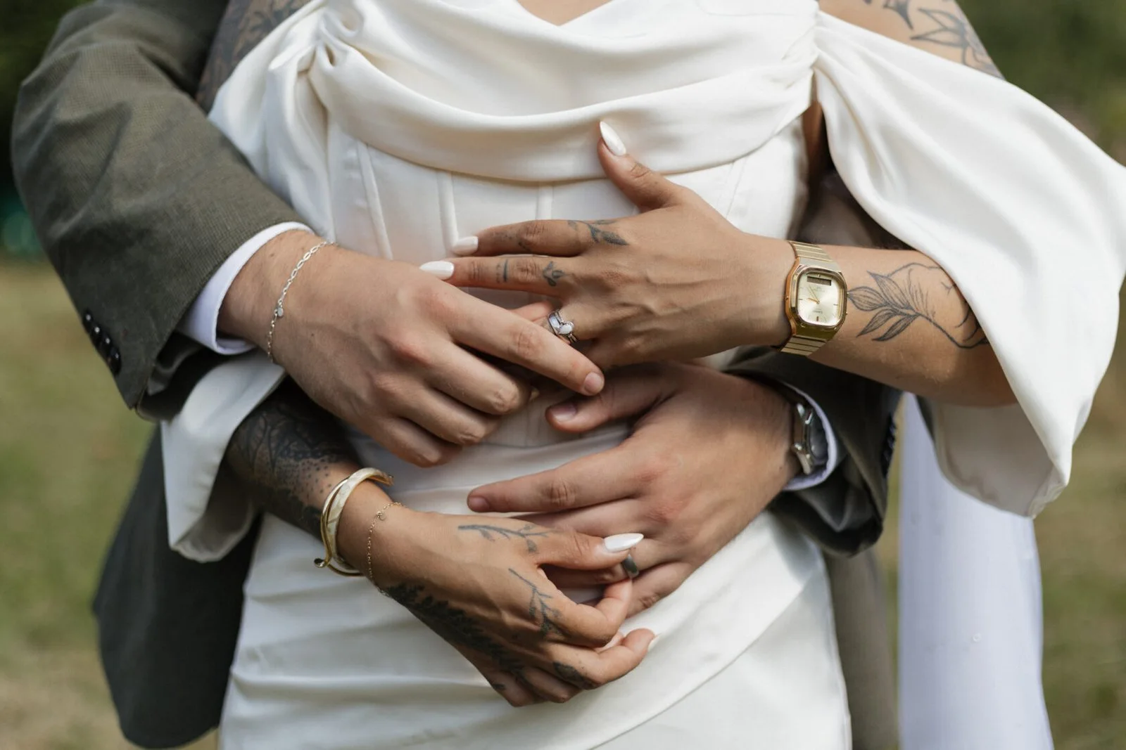Close-up of newlyweds embracing after their ceremony