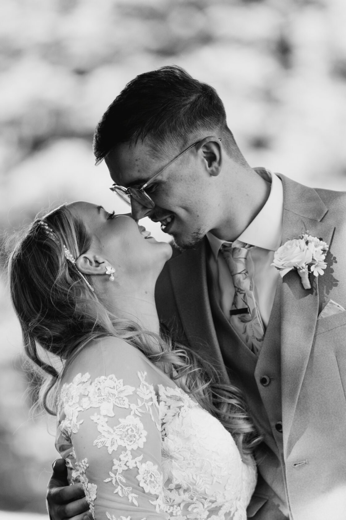 Newlyweds sharing a close portrait in black and white