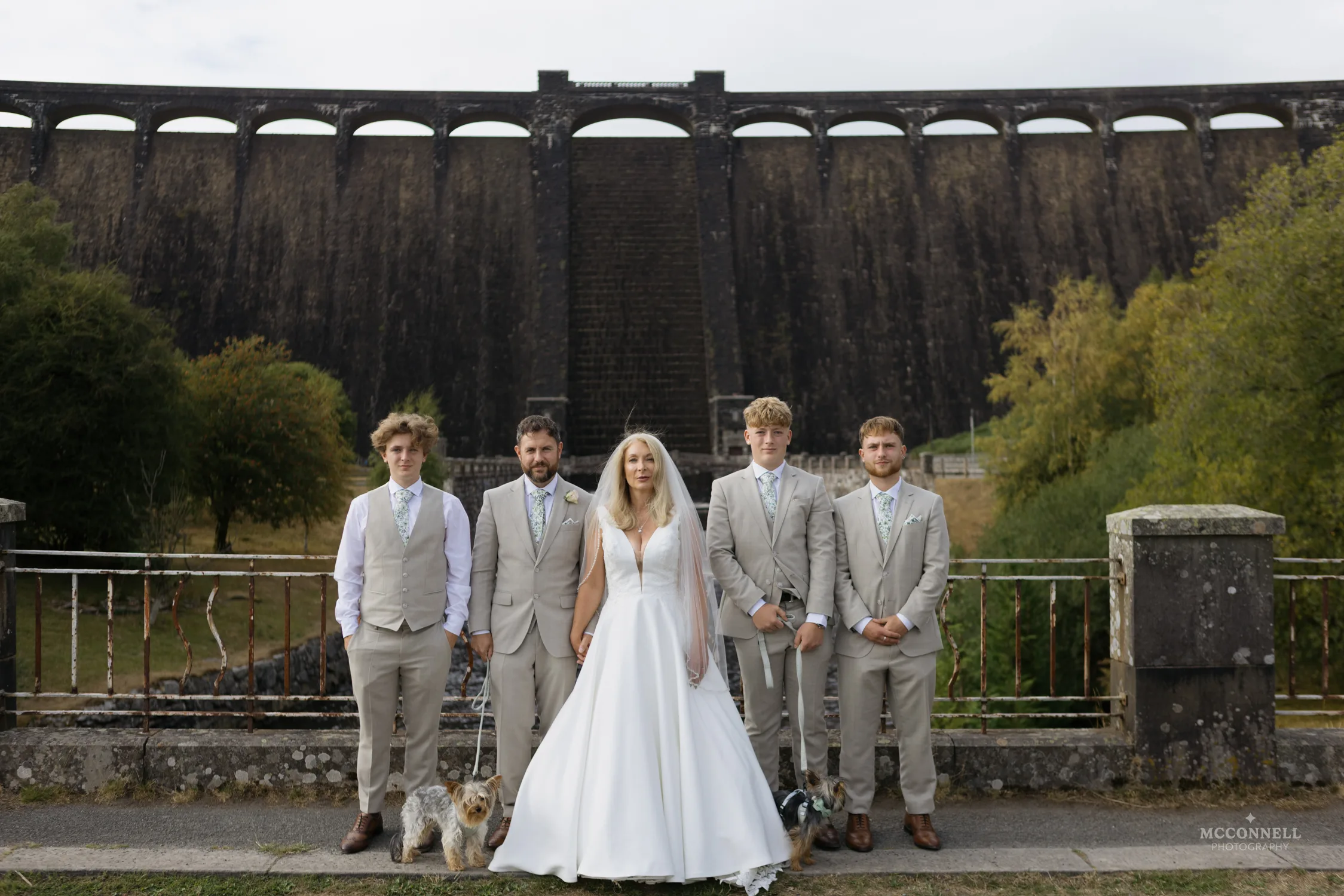 Debi and Ryan with their family and two dogs in front of Pen y Garreg Dam