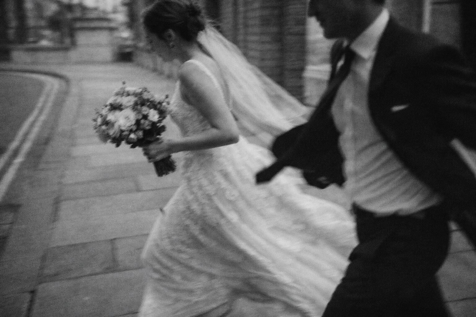 Couple walking together through the city with creative motion blur